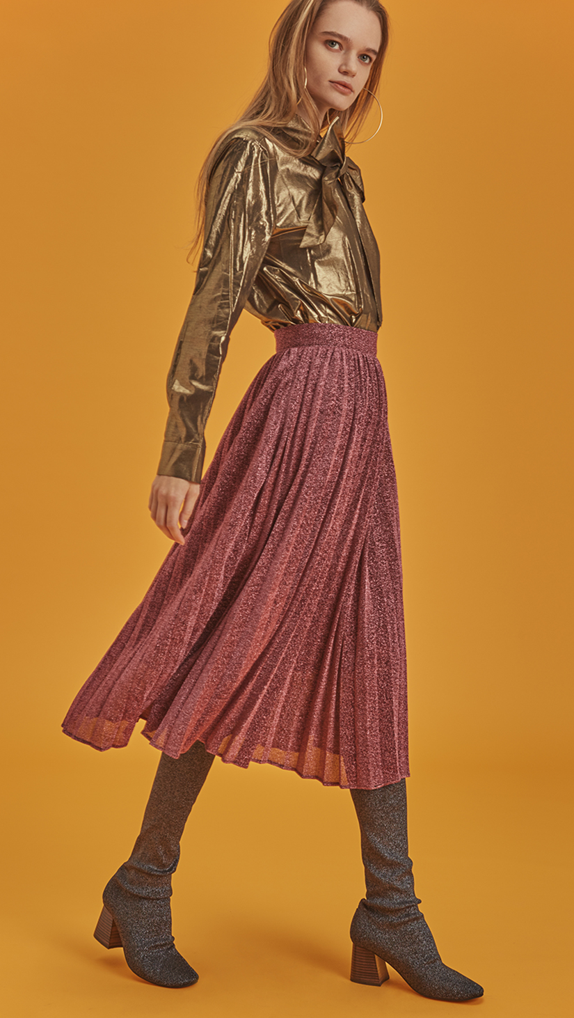 The Aurellia Skirt is a A-line pleats skirt with flattering glitter in pink. With a concealed zip fastening closure at waistband, midi length skirt, fully lined.   