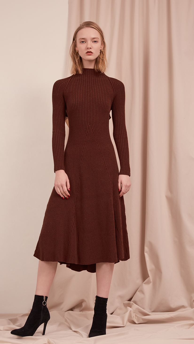 The Leila Dress in Dark Mocha. With ribbed midi dress with cut out back and white cotton tie open back. A-line shape. Slightly loose fit. Mid-weight. Stretchy fabric.