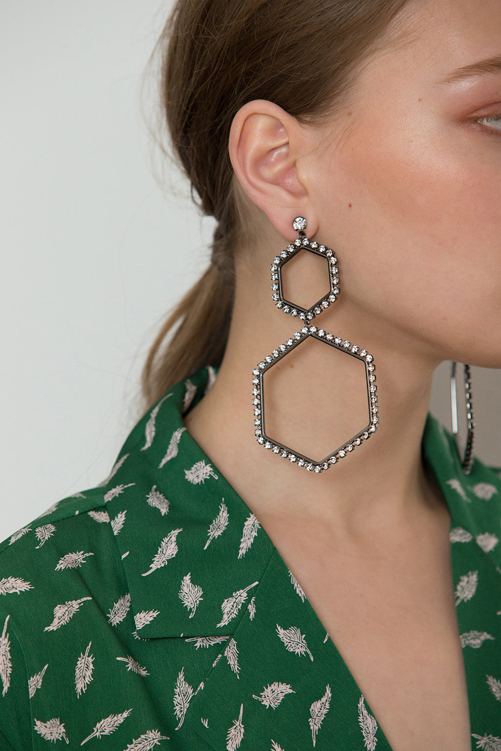 The Abaca Earring, a pair of diamond-shaped earring in Sliver. Post back. Sold as a set.