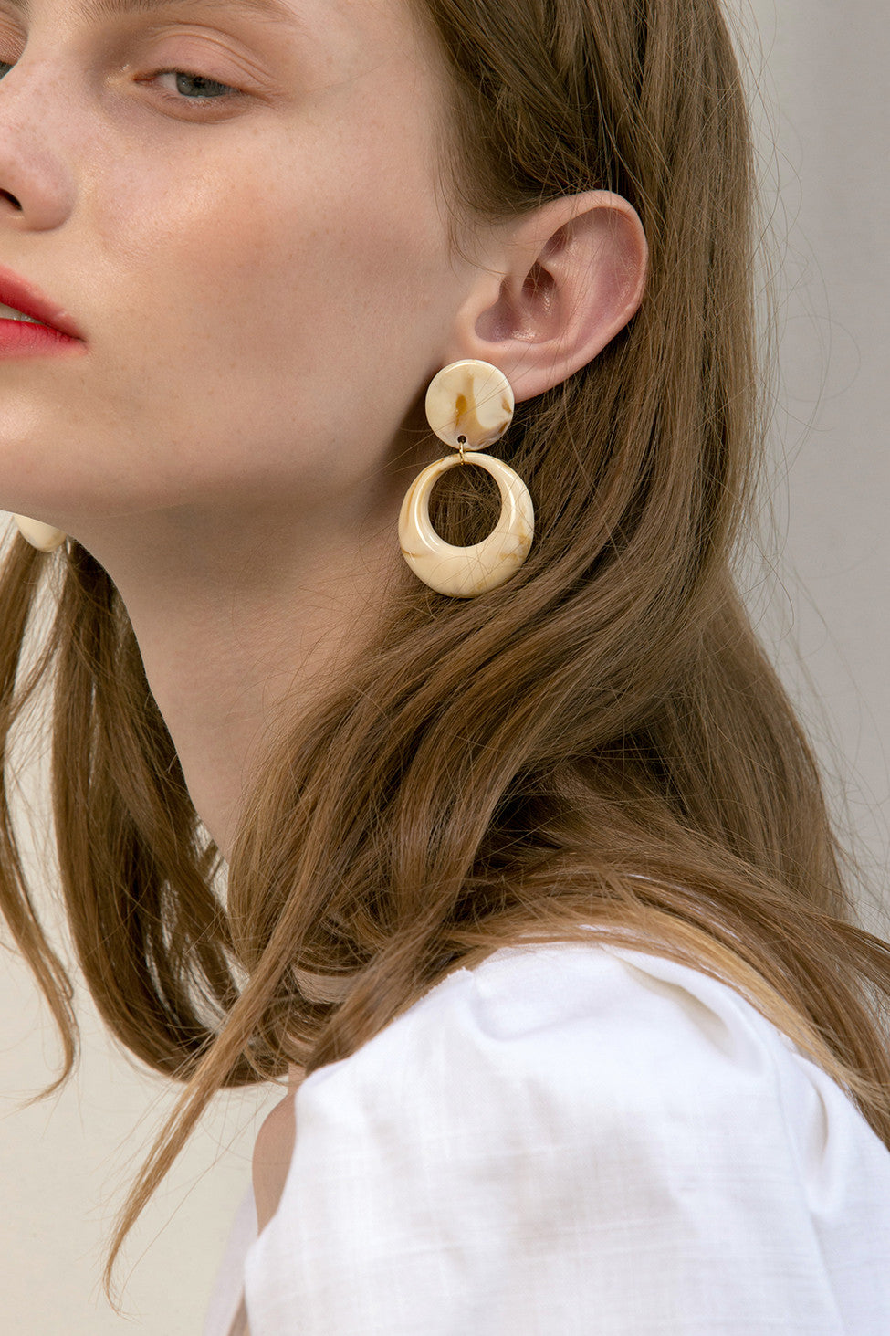 The Angia, a pair of acutate round drop earrings. Metal post back. Sold as a set.