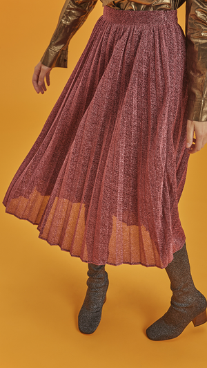 The Aurellia Skirt is a A-line pleats skirt with flattering glitter in pink. With a concealed zip fastening closure at waistband, midi length skirt, fully lined.   