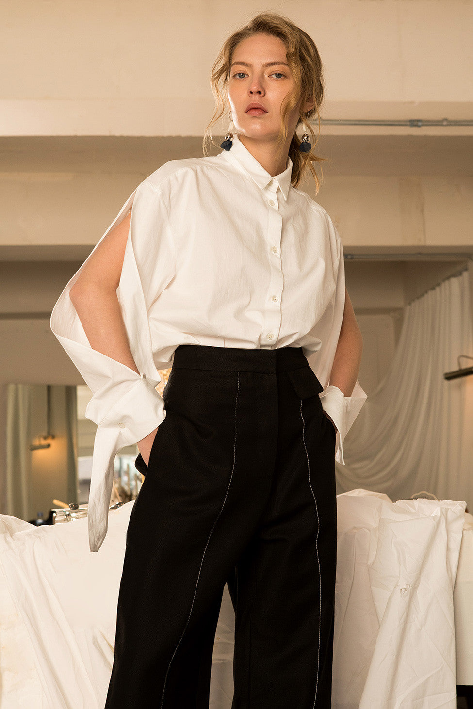The Azour Shirt in Off White, featuring classic button down, pointed collar, voluminous deep slits sleeves with barrels cuff detail, single-button angle cuff.