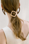 Round wooden in beige hair clip with gold metal fasten. Parisian barrette. 