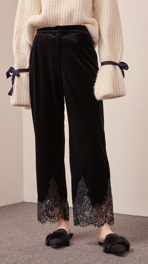 The Capri pant in velvet black with lace hem, hook and zip fly front, gathered elasticated waistband. 