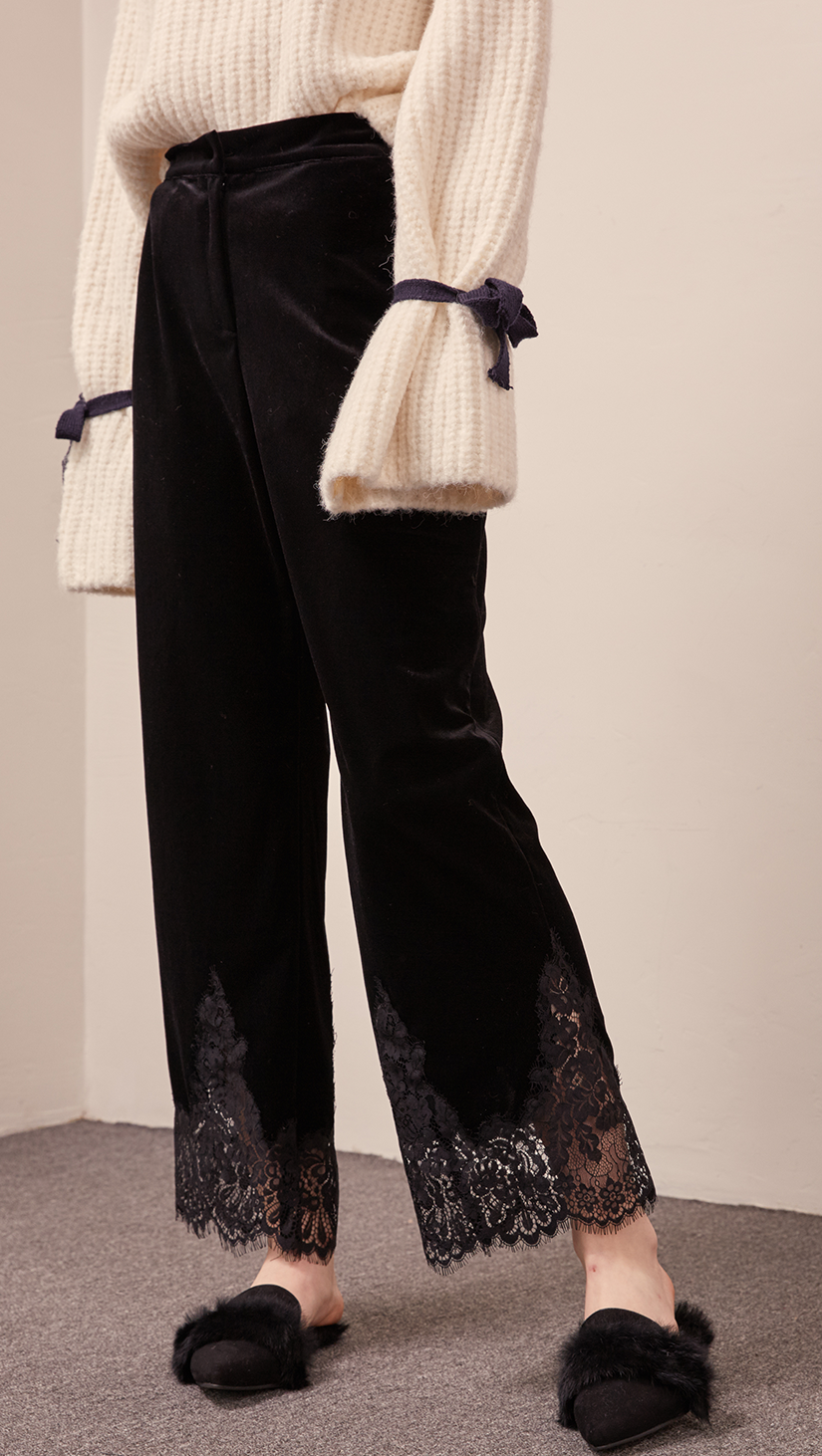 The Capri pant in velvet black with lace hem, hook and zip fly front, gathered elasticated waistband. 