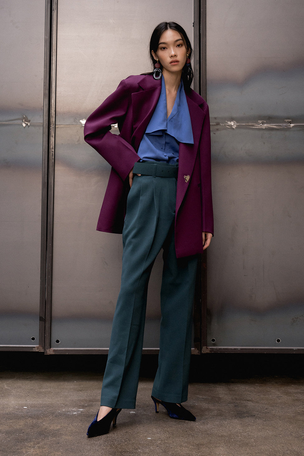 Suit wool jacket from Carlotta Jacket in deep violet. Notch lapel. Dropped shoulders. Left chest pocket. Long sleeves with slits at cuff. Hook and eye closure at front.