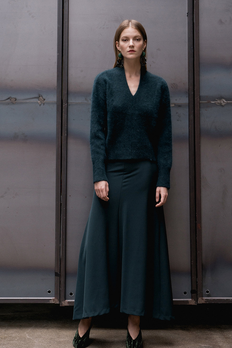 The Cecily angora sweater, long sleeved pullover with deep V-neck in forest green wool blend. Dropped shoulder.