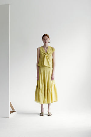 The Dhara Skirt in Chartreuse featuring ruffle pleats in fluted edge, concealed size zip closure, high waist in ankle length. 