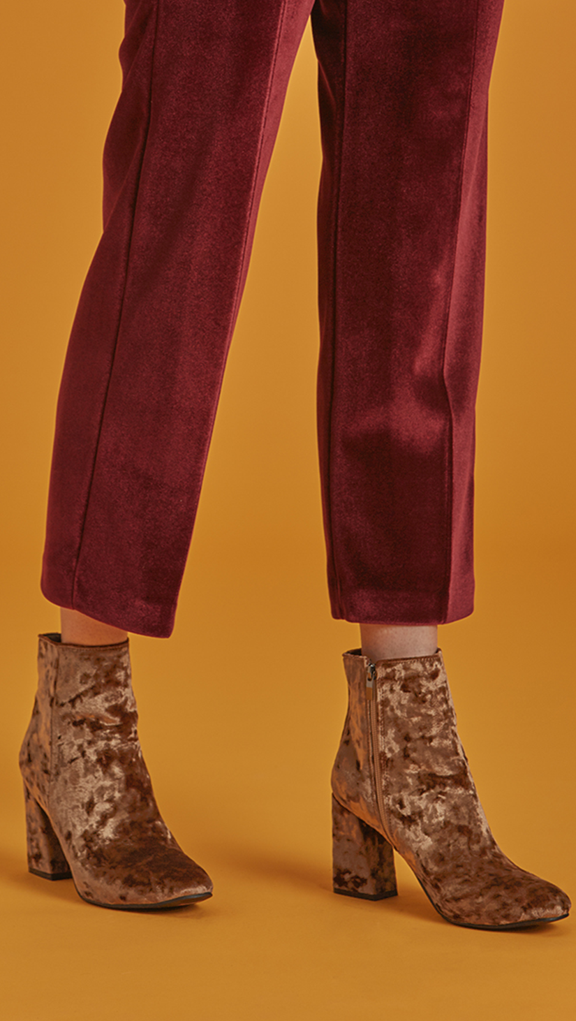 The Dillon is lustrous moss-yellow velvet ankle boots with matching velvet-covered blocked heel. Almond toe, side zip fastening. Second-skin silhouette. Ankle length.