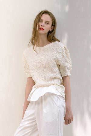 The Farrah in Ivory featuring ruched detailing, quarter sleeves with puffs. Pull on