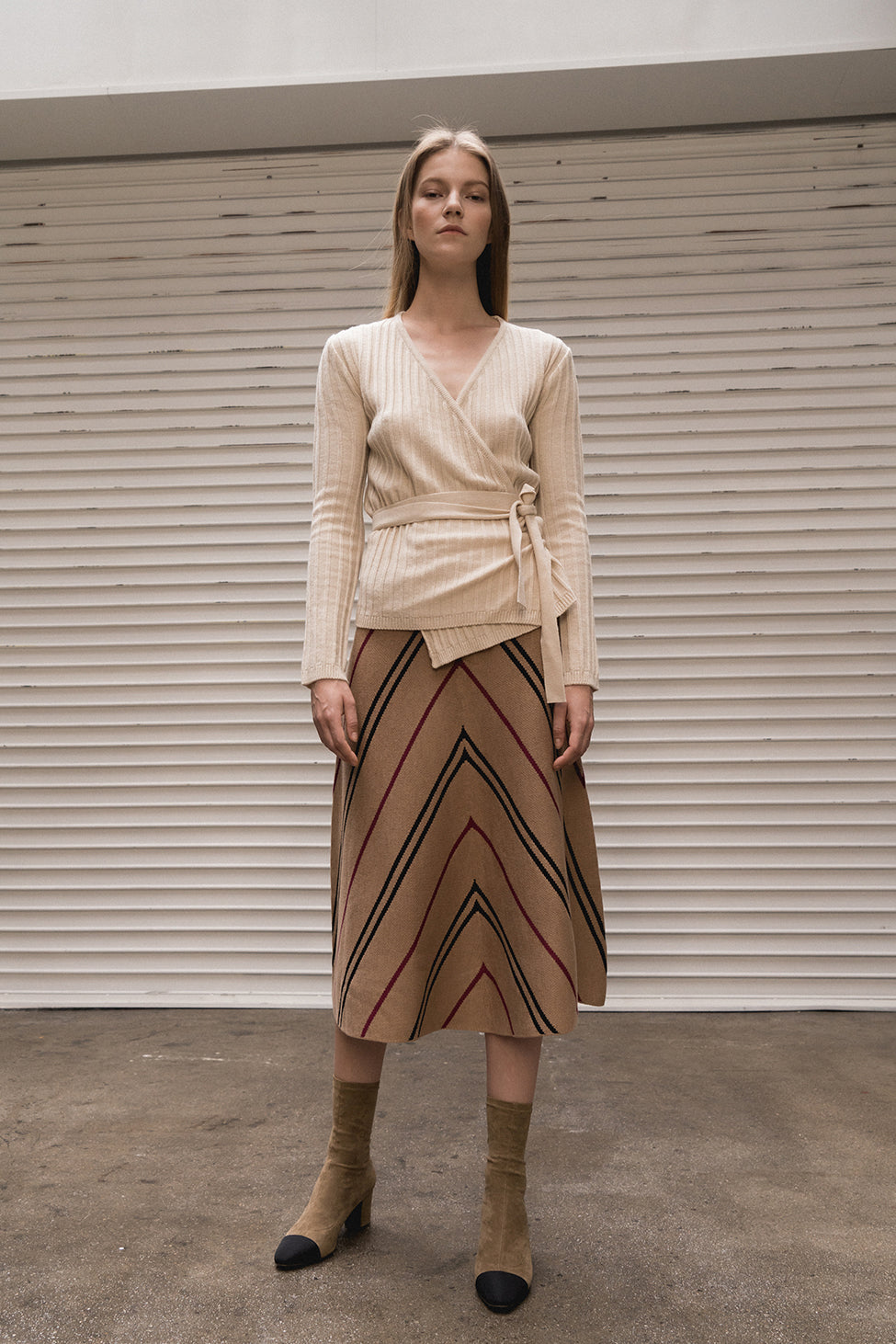 Mid-length skirt from stripe in Brown. High rise. Elasticated waistband. A-line silhouette.