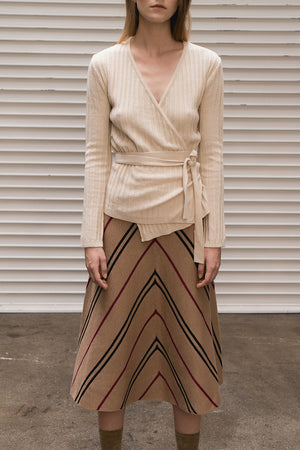 Mid-length skirt from stripe in Brown. High rise. Elasticated waistband. A-line silhouette.