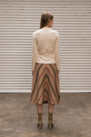 Mid-length skirt from stripe in Brown. High rise. Elasticated waistband. A-line silhouette.