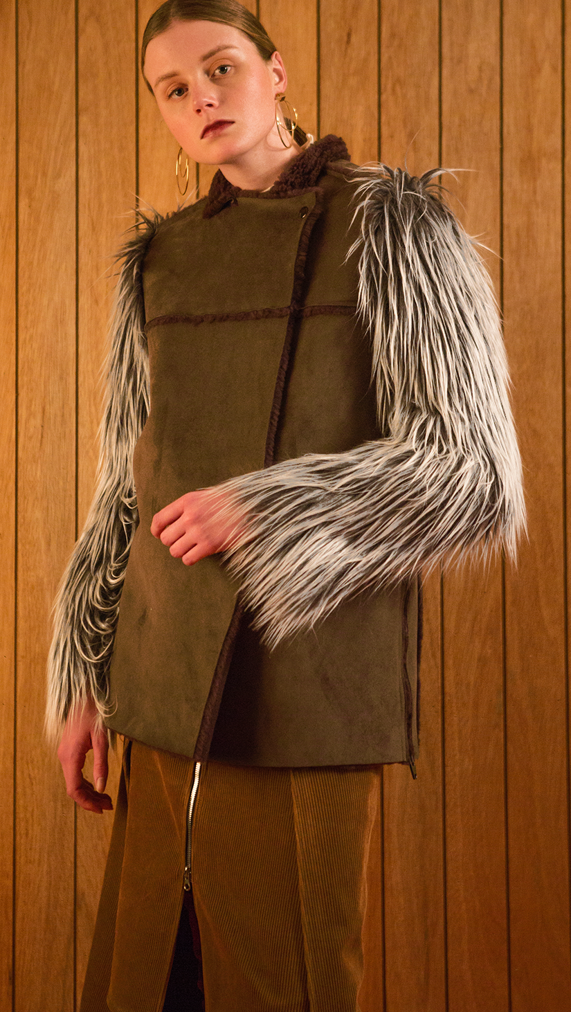 The Hanneli Shearling Jacket in Khaki. With a dramatic faux-Mongolian fur covered sleeves, front snap button closing, fully shearling lining. Oversized silhouette.  