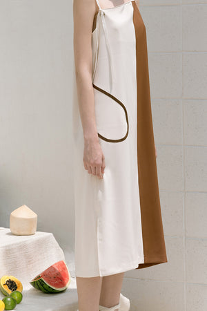 The Hayett dress in asymmetric neckline with thin shoulder strap and side slits. Pull on. 