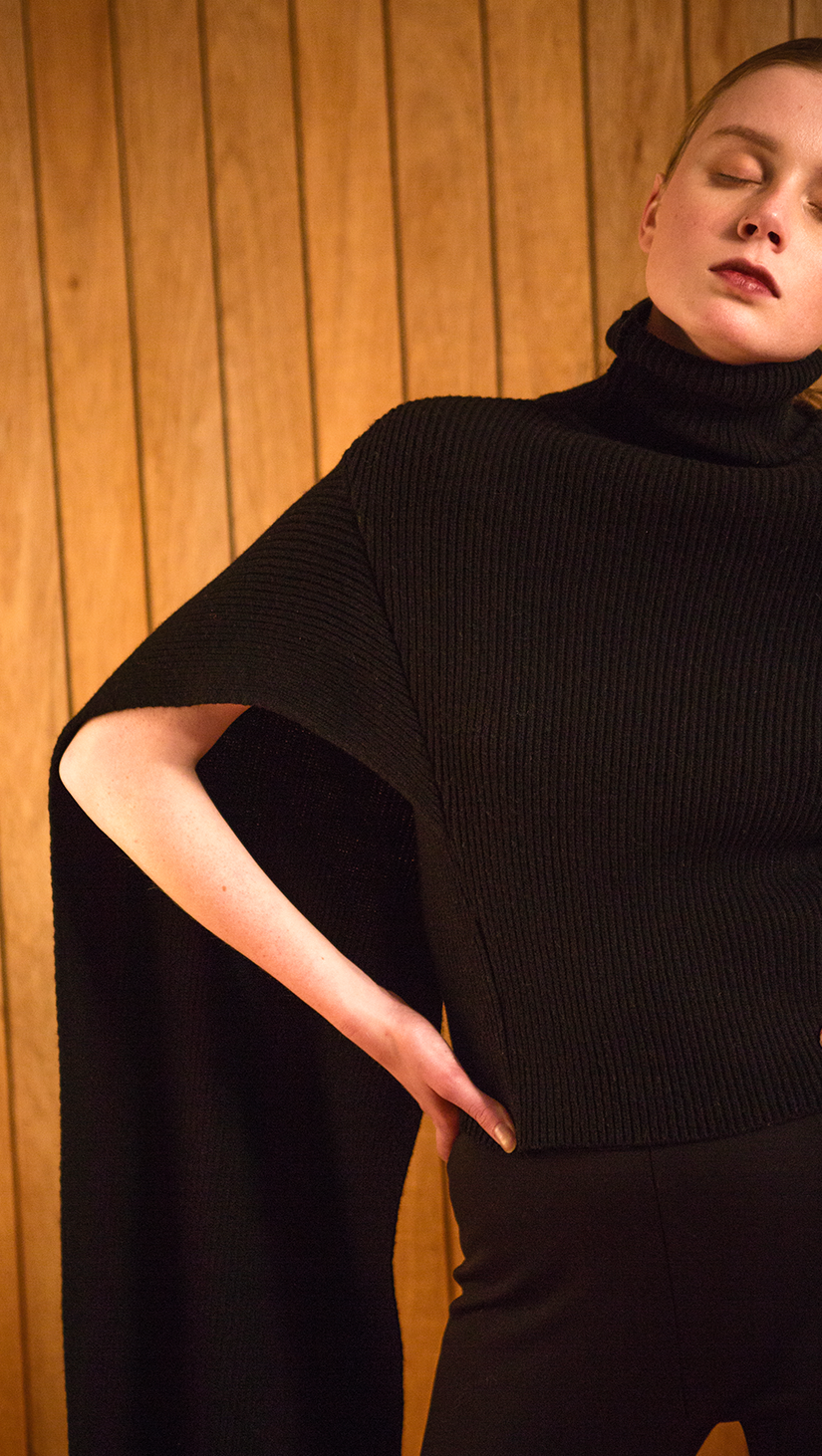 The Hensley is a sweater in extra long length sleeves. Poncho-style, ribbed knit in turtleneck. Light-weight.