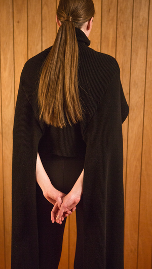 The Hensley is a sweater in extra long length sleeves. Poncho-style, ribbed knit in turtleneck. Light-weight.