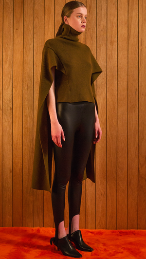 The Hensley is a sweater in extra long length sleeves. Poncho-style, ribbed knit in turtleneck. Light-weight.