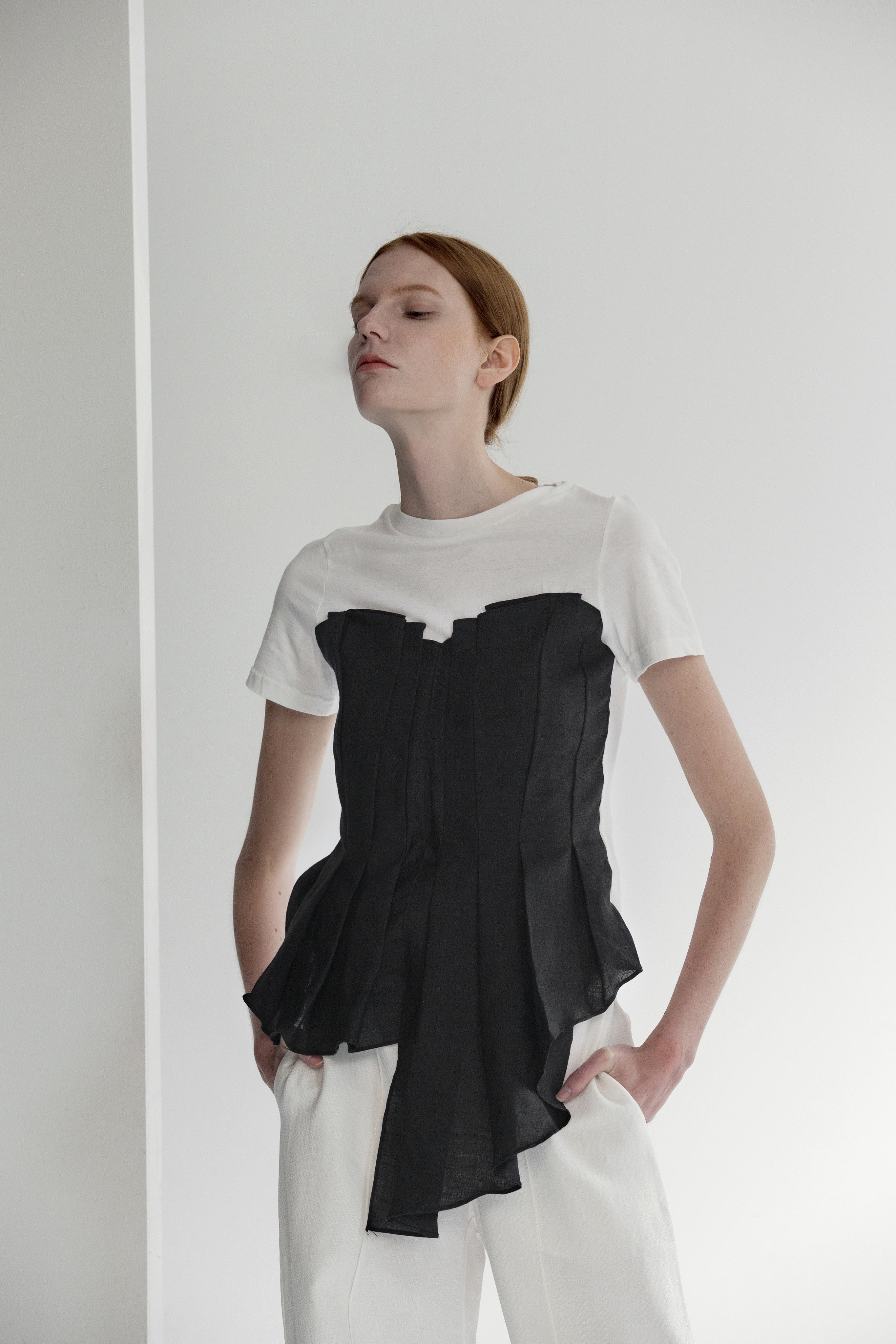 Tee shirt inspired Harvey Top in short sleeve with boat neckline, folded asymmetric origami bodice detailing. Pull on.
