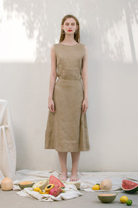 The Janelle Skirt in Beige featuring pleated waist, ankle length. Straight hem. Concealed zip fastening at back.