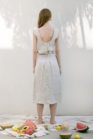 The Janelle Skirt in Ivory featuring pleated waist, ankle length. Straight hem. Concealed zip fastening at back.