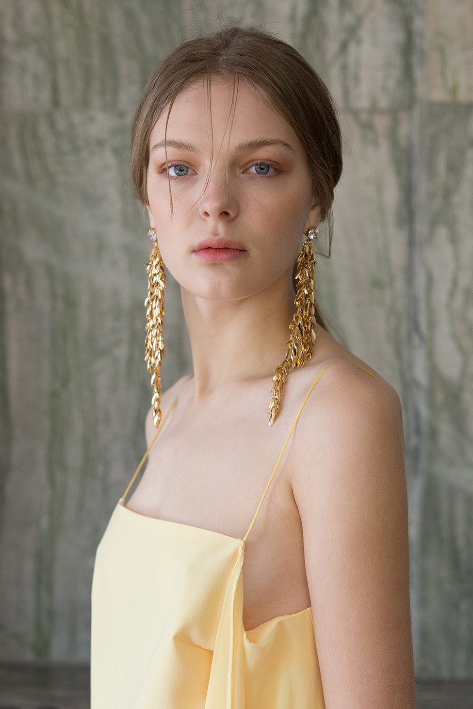 The Jupe, a pair of drop earrings in Gold. Delicate chain design with cubic stud. Post back. Sold as a set.