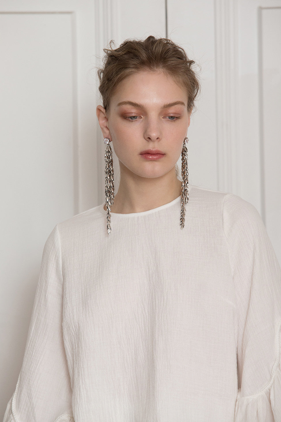 The Jupe, a pair of drop earrings in Sliver. Delicate chain design with cubic stud. Post back. Sold as a set.