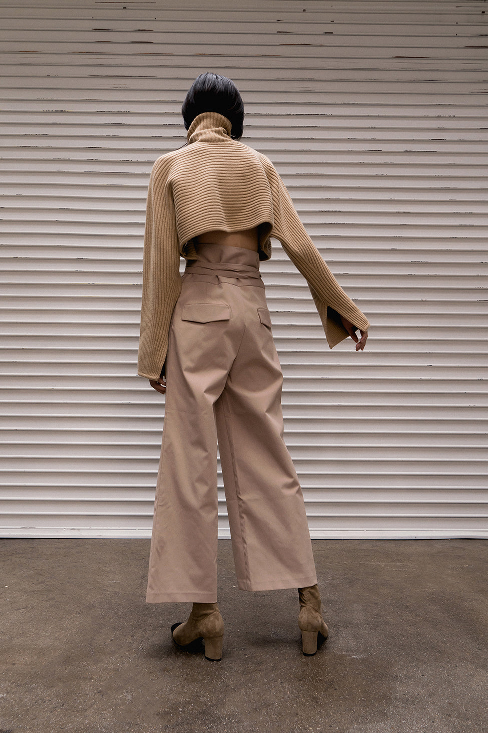 The Kasumi easy trousers in beige featuring high rise, gathered elastic paperboy waist with non-detachable tie-belt. One-seam back pockets. Pleats from front waist. Concealed zip closure at side. Relaxed straight leg. Full-length. Casual fit.