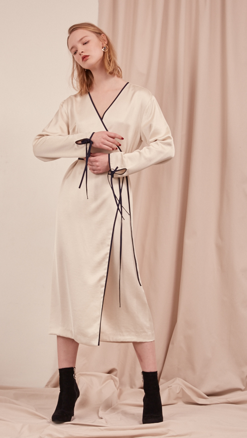 The Gabe Dress in Ivory. With wrap front, self-tie at waist. Lightweight. Super soft feel. Midi length, particularly long in length.