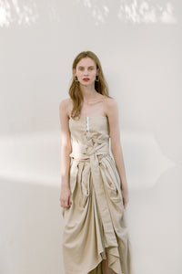 The Keria skirt in draped front skirt with detachable sash belt. Concealed back zip closure. Mid length. 