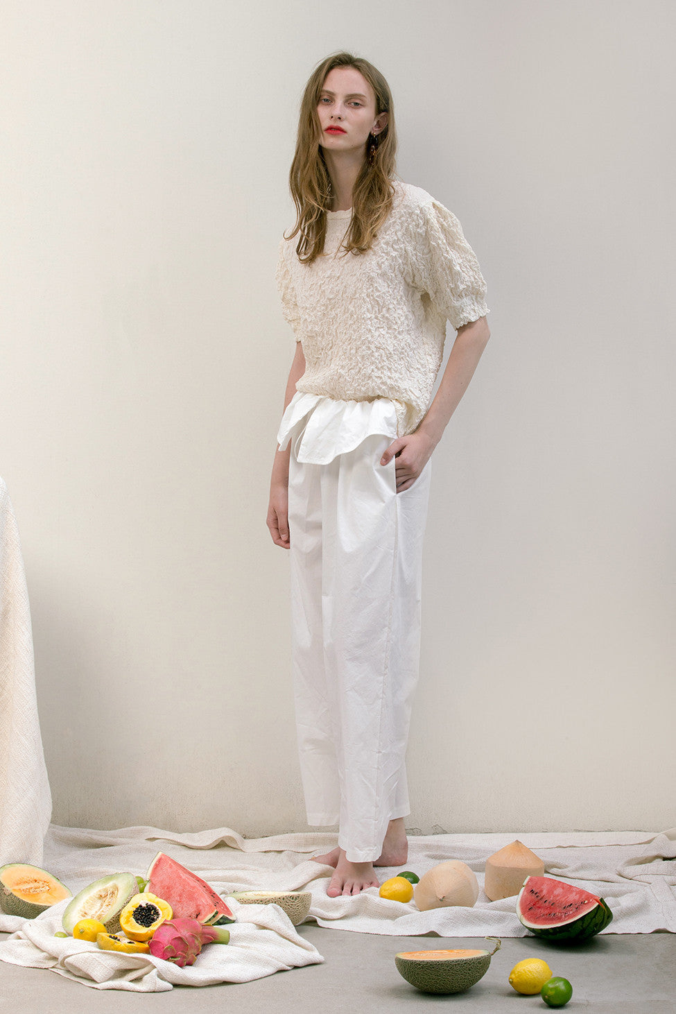 The Lassie Pant in white featuring elastic waistband, two slant pockets. Lightweight.