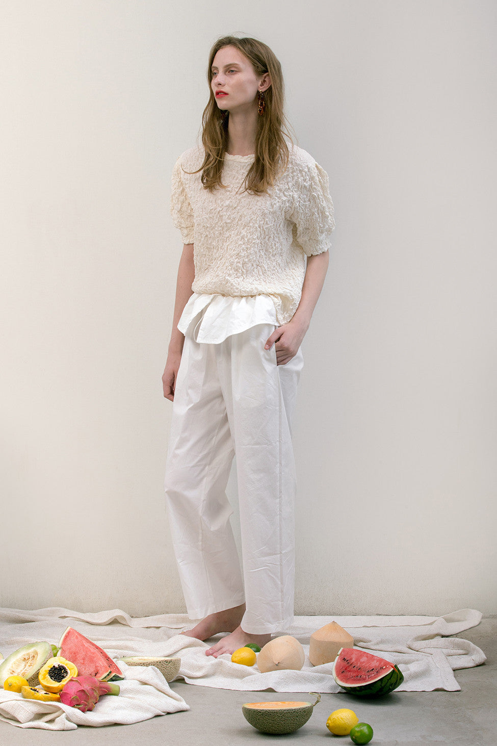 The Lassie Pant in white featuring elastic waistband, two slant pockets. Lightweight.