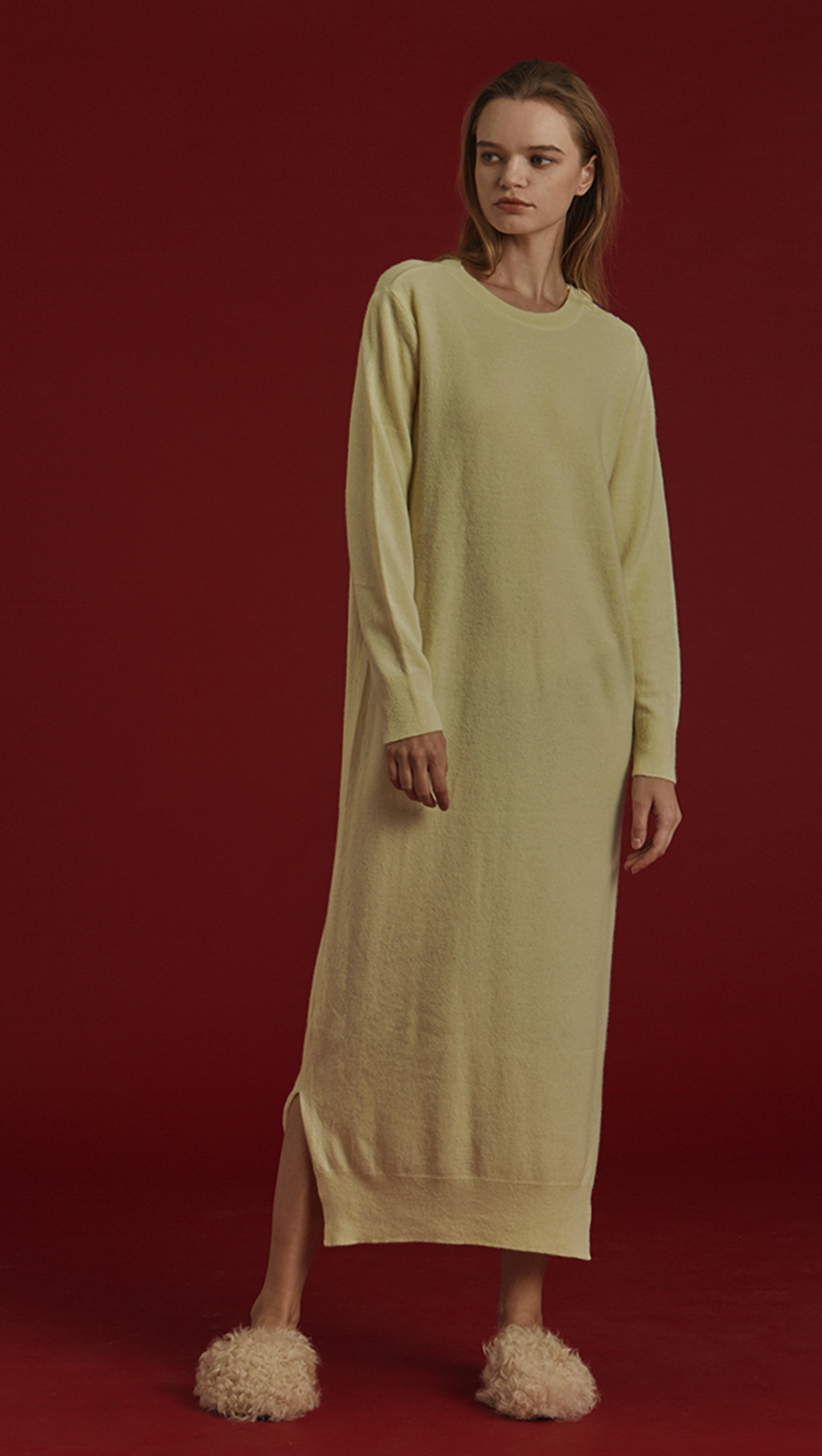 Latt Knit Dress in lime-yellow, with a stretch super soft wool. Button detailing along neckline. Pull on. Designed to be loose fit. Extra long in length.