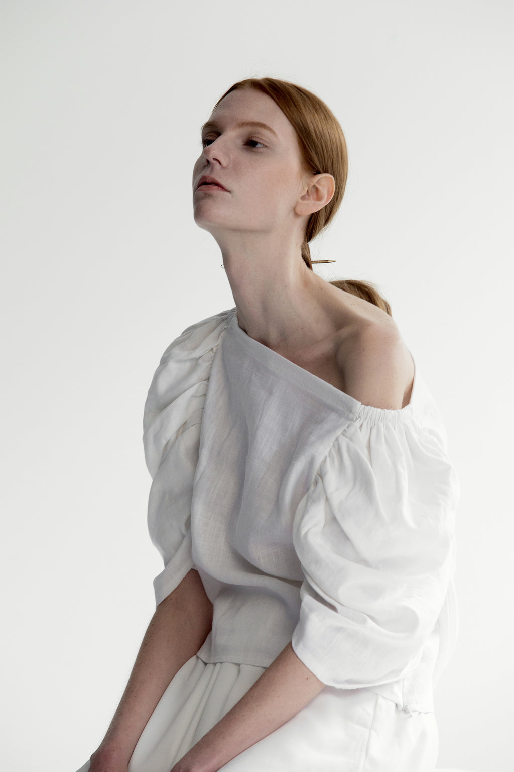 The Lazaro Top in White featuring ruched quarter sleeve with square neckline, cinching pleated detailing. Pull on.
