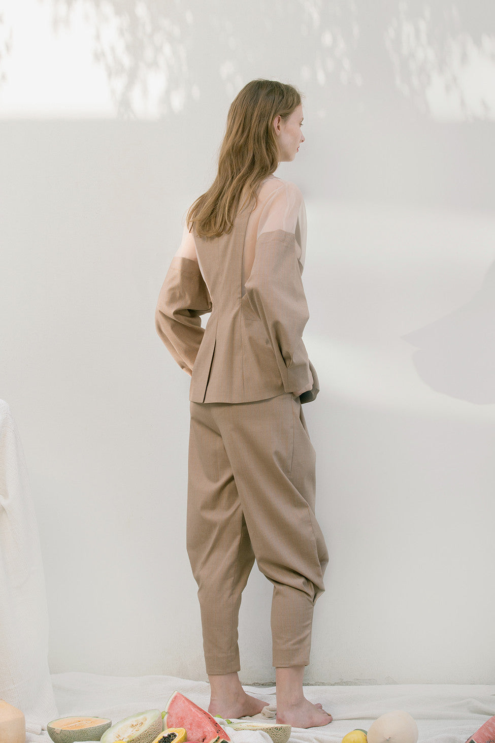 The Luella Pant in brown featuring slim, tapered leg with cuff detail. Mid rise. Dropped crotch. Slanted front pockets. Zip fly with hook-and-bar closure. Lightweight.