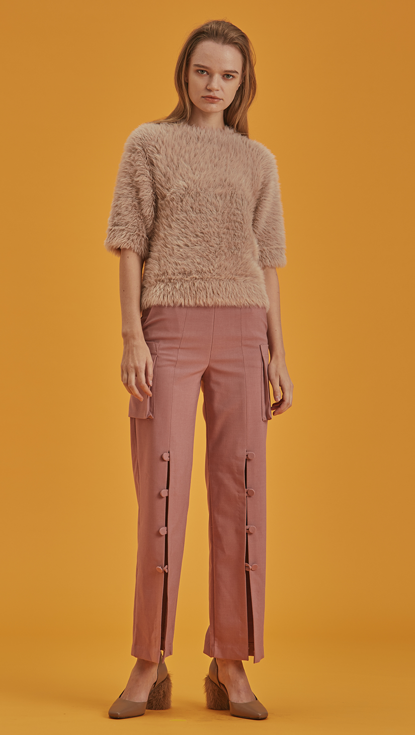 Short sleeved pullover with statement furry in matte pink. Soft feel texture. Furry interior. Pull on. 