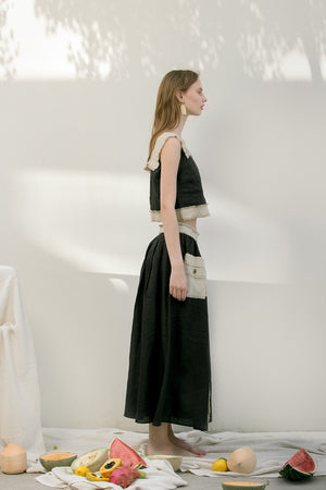 The Maretta Skirt featuring raw edge pocket and concealed side zip closure.