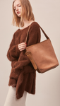 The Merette shoulder bag in camel corduroy with top handle in adjustable fastening.