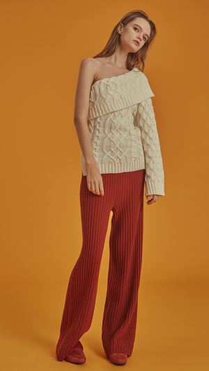 The Mikaela Pant is brick wool trousers sit high on the waist with an elasticated ribbed-knit trim. Wide leg cut. No pockets. Relaxed fit. Wholegarment Made.