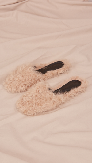 Études Furry Slide in Ivory Shearling. Shearling mule, created entirely with curly lambs wool. Slide loafers with a round square toe, padded leather foot bed and rubber soles. Slip on.  