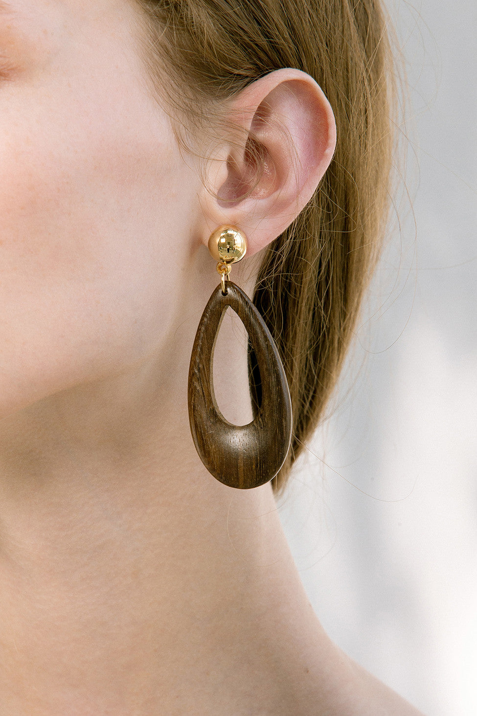 The Nirav, a pair of water drop shaped earring in wood. Gold metal post back. Sold as a set.