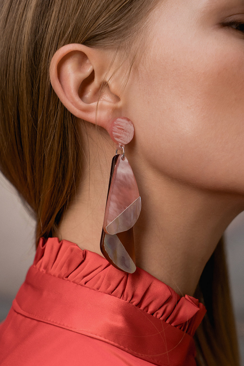 The Rafaella Earring, a pair of geometric motif shaped earring in Pink. Post back with friction closure. Sold as a set.