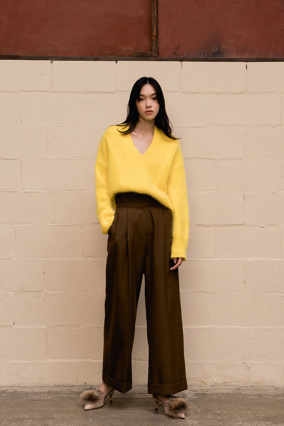 The Heiko pant featuring high rise, zip fly with hook-and-bar closure, non-removable coordinating belts along side. Front slash pockets. Folded hem. Wide leg. Straight fit.