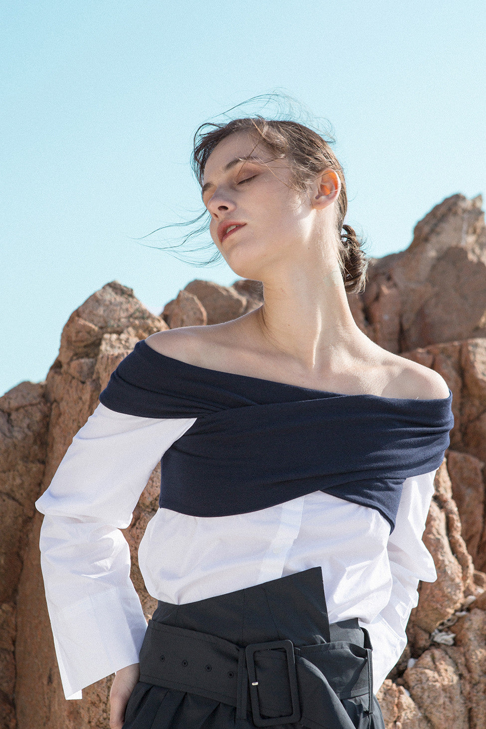 The Roio Top featuring off-the-shoulder neckline with button-down shirt and long sleeves.