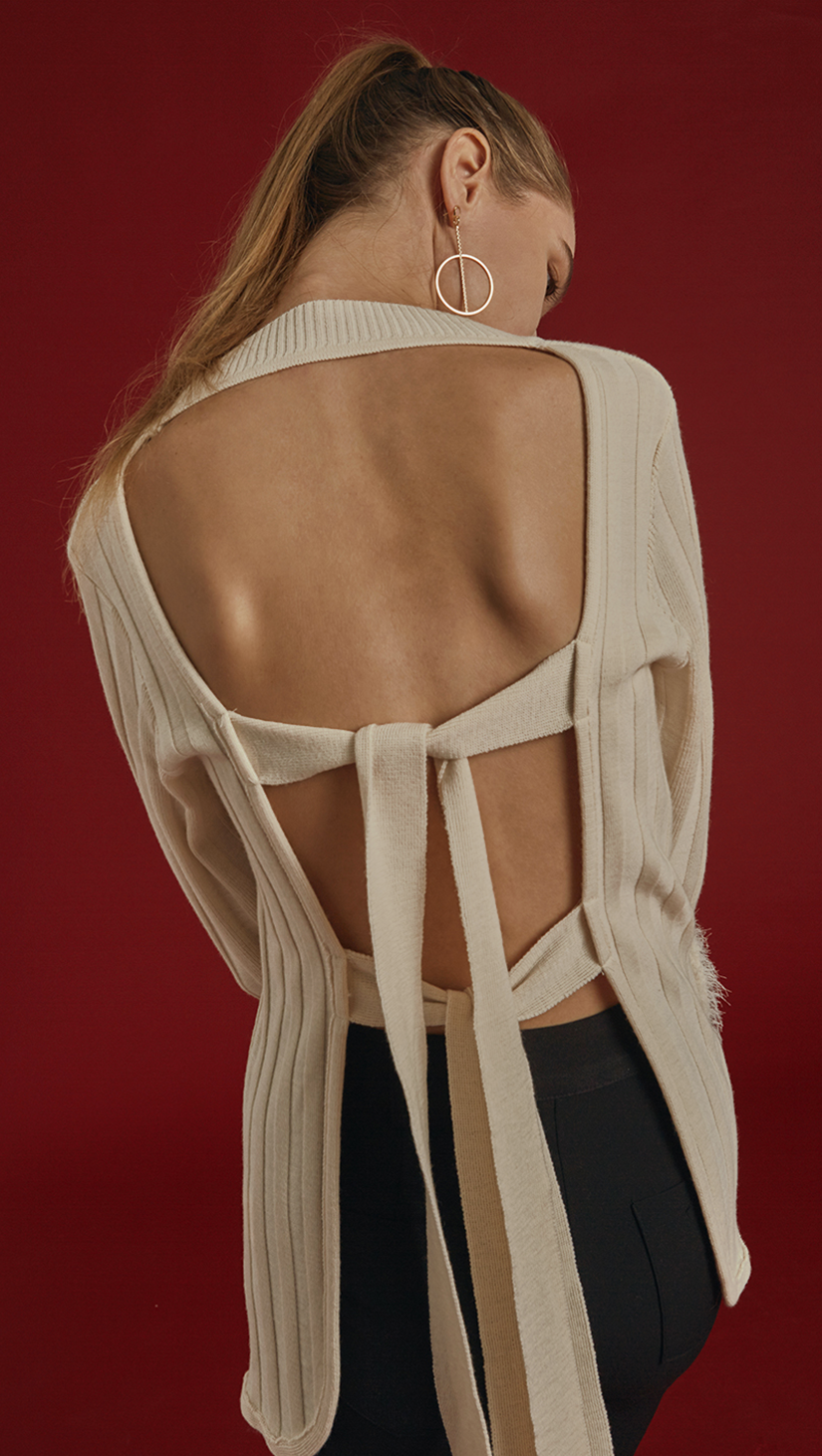 Rosendale Knit in Ivory. With a faux shearling cuffs in contrasted colour and button closing detail, backless with extra long self-tie closure. Open rib details. Designed to be slightly relaxed fit.