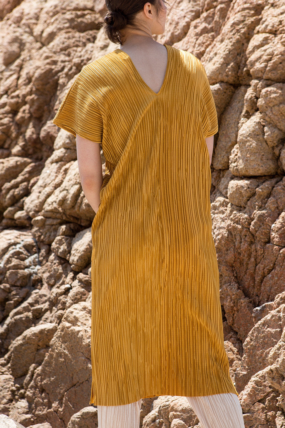The Rossellini pleats dress in Mustard, featuring v-neckline, cap short sleeves. Pull-on design.