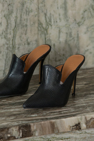 The Vavarta heel in Black. Almond toe. Slip-on design.
