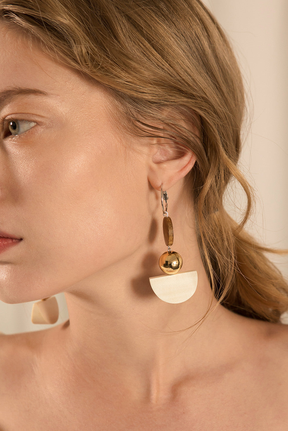 The Venn, a pair of wood and gold drop earring. Post back. Sold as a set.