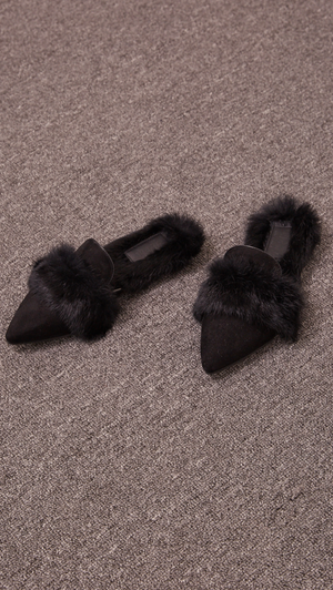 Yulie Furry Slide in Black Shearling. Shearling mule, created entirely with faux ribbit fur. Slide loafers with a almond square toe, padded leather foot bed and rubber soles. Slip on.  